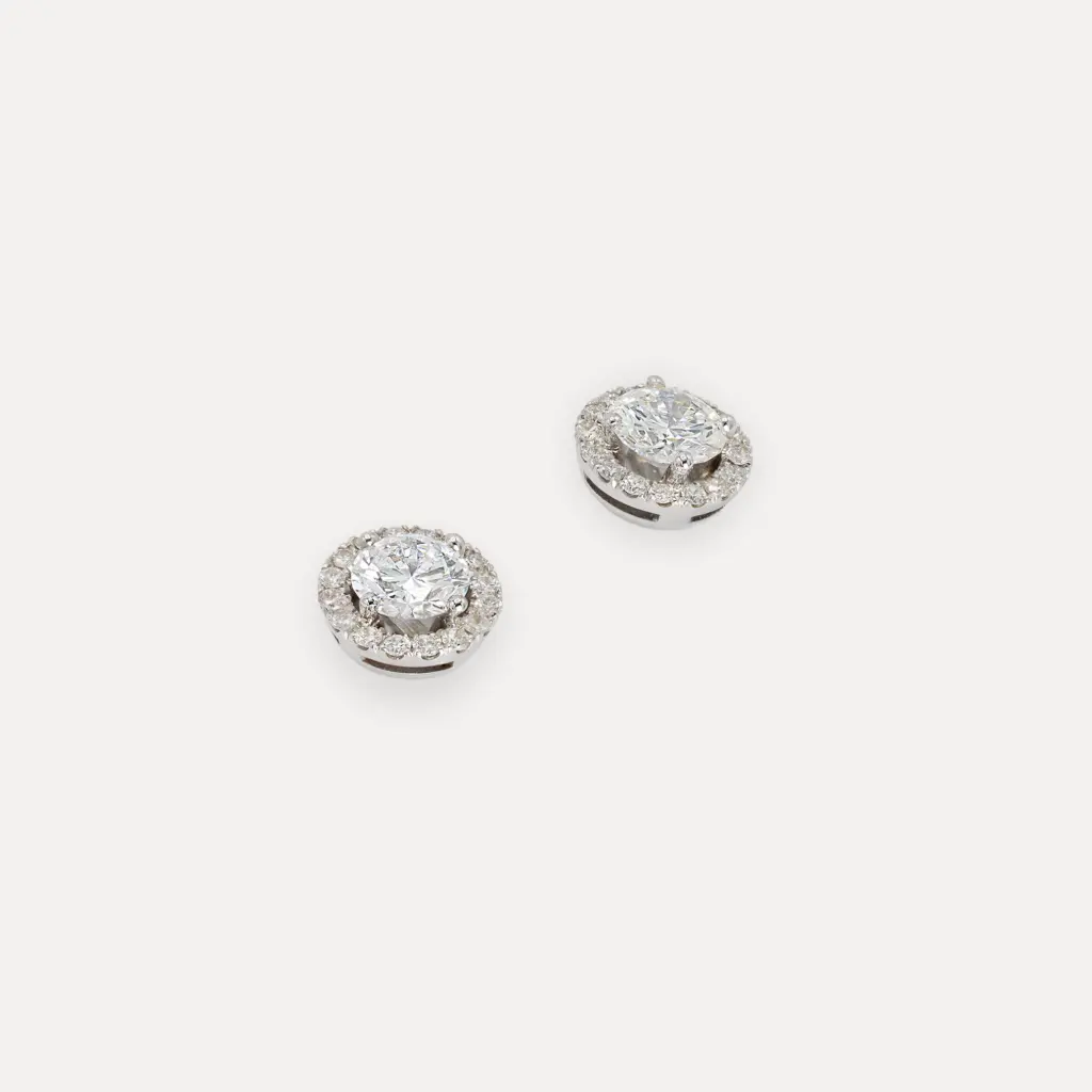 Boucle d'oreille blanc 18Kt. 0.72 f vvs1 et 0.70 d vvs2 coté 0.32 ct